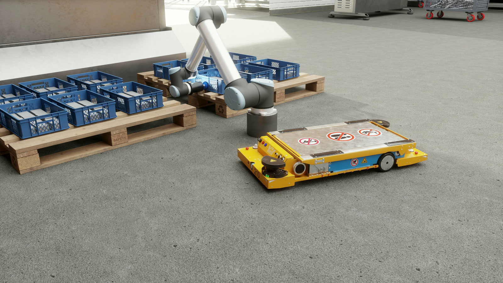 UR10 manipulator loading parts onto an AGV inside the simulated factory